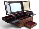 a wooden box with three drawers and a mirror in it