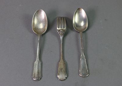three spoons and two spoon spoons on a table