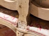 a close up of a chair with a floral pattern on it