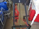 a small hand truck with a handle on it in a garage