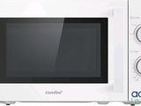 a white microwave that is sitting on a white table