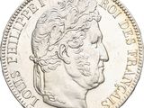 gros plan d'une pièce de monnaie sur laquelle figure une tête d'homme