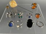 a clear display case with various rings and rings on it