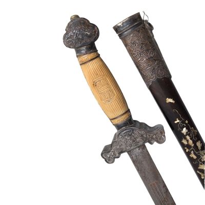 pair of antique chinese swords with wooden handles and carved handles
