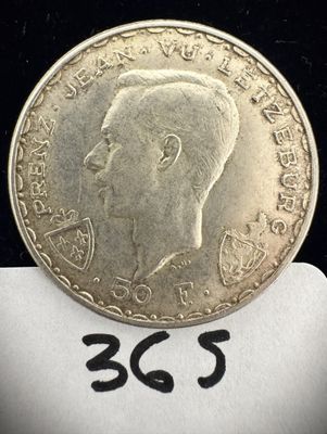 une image représentant une pièce d'argent sur laquelle figure le portrait d'un homme