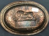a bronze plaque with a horse on it
