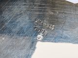 a close up of a piece of metal with some screws on it