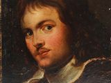 portrait d'un jeune homme vêtu d'un manteau noir et d'une chemise à col blanc
