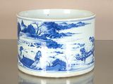 a blue and white bowl sitting on top of a table