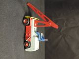 a toy truck with a crane attached to it ' s side