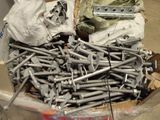 a lot of screws and bolts in a box
