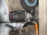 an image of a pile of tools in a metal cabinet