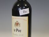 a bottle of wine that is sitting on a table