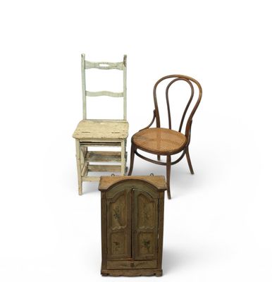 three chairs and a cabinet are sitting next to each other on a white surface