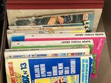 a lot of books on a shelf next to a book case