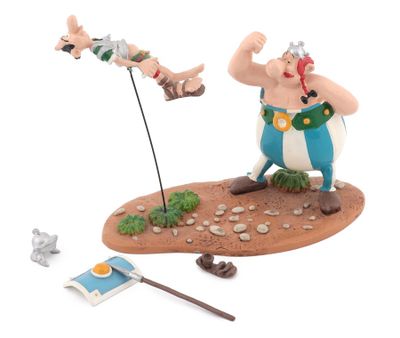 the figurine of a man with a sword and a sword in his hand