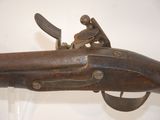 an old gun that is on display in a museum