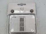 an id card attached to the back of a cell phone