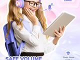 a girl wearing headphones and holding a tablet with the words safe volume protect kids ' s hearing
