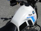 a close up of a motorcycle parked in a parking lot