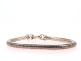 a close up of a bracelet on a white background