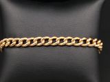 un bracelet en chaîne d'or sur un mannequin, un mannequin, un mannequin, un mannequin, un mannequin, un mannequin, un mannequin, un mannequin, un mannequin, un mannequin, un mannequin, un mannequin, un mannequin, un mannequin, un mannequin, un mannequin, un mannequin, un mannequin, un mannequin, un mannequin, un mannequin, un mannequin, un mannequin, un mannequin, un mannequin, un mannequin, un mannequin, un mannequin, un mannequin, un mannequin, un mannequin, un mannequin