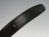 a black belt with a metal buckle on it