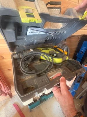 a man that is working on a tool box