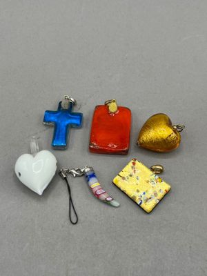 four different pieces of glass with a cross, a heart, and a cross on it