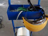 a blue cart with tools and a roll of tape on it