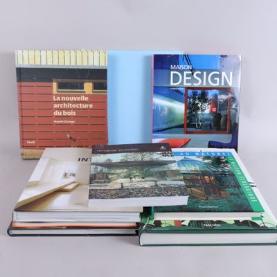 several books are stacked on top of each other on a table