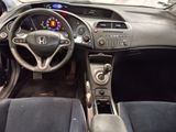 a dashboard of a car with a steering wheel and dashboard lights