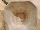 a cup that is sitting on a wooden table