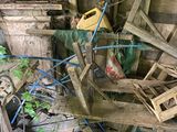 a pile of wood and a canister of gas in a room