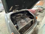 a car that has been burnt out in a parking lot