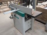 a picture of a table sawing machine in a wood shop