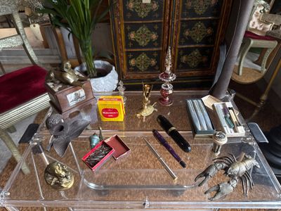 a glass table with a lot of items on it