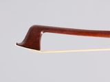 a close up of a violin bow on a white background
