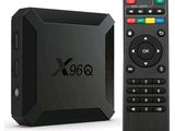 a black box with a remote control next to it
