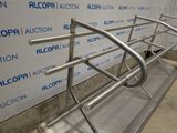 a metal rack that has been placed in front of a wall