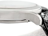 a close up of a watch on a white surface