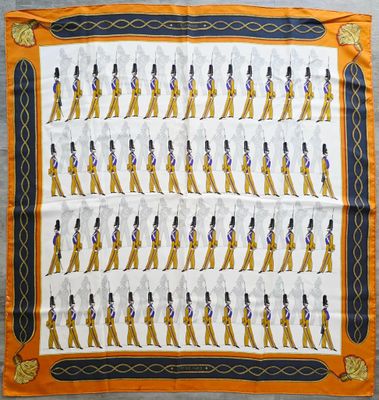 a close up of a scarf with a picture of a marching band