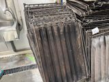 a pile of old metal items in a room