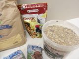 a bowl of granola and a bag of granola next to a bag of granola