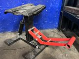 a red chair that is sitting in front of a blue wall