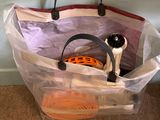 a plastic bag with items inside of it on the floor