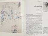 an open book with a drawing of a man and a woman