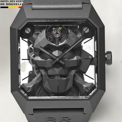 the watch is made out of black plastic and has a face made out of metal