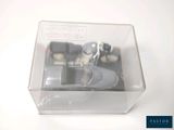 a small toy car in a clear box on a table