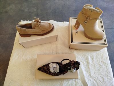two pairs of shoes that are sitting on a table